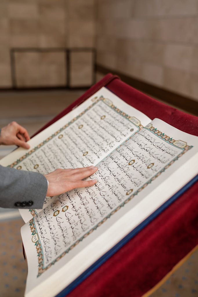 A Person Holding a Koran Book-quranbook